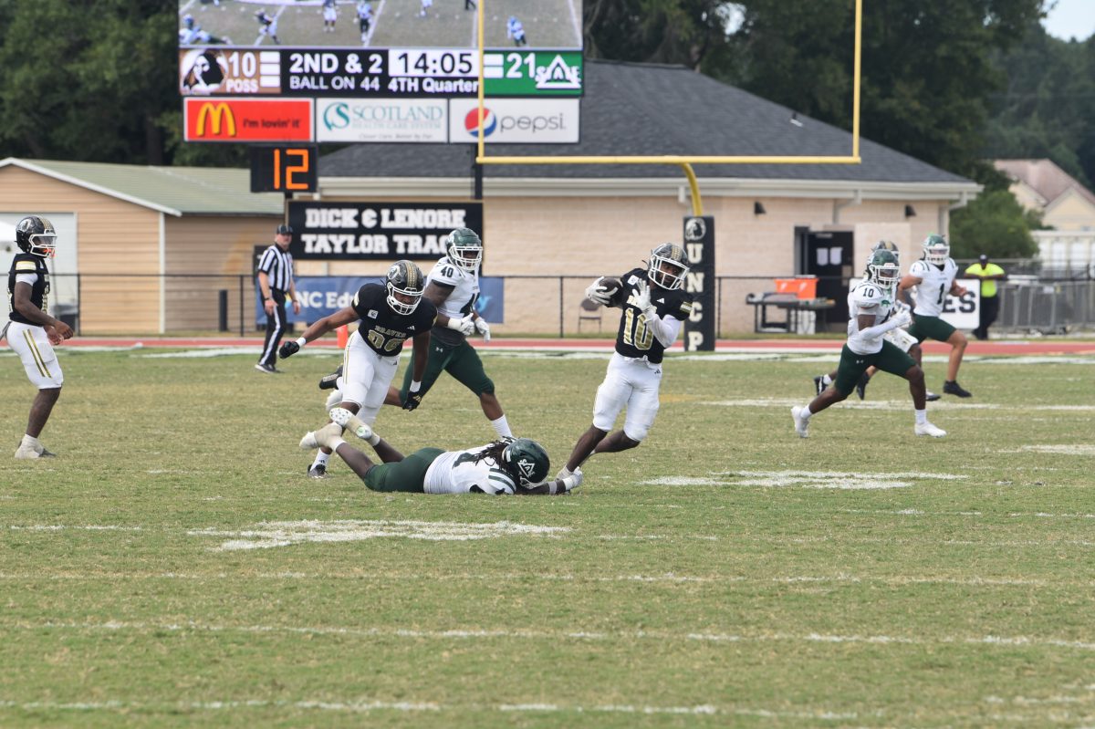 Jaquan Albright fights for extra yards after breaking a tackle against Delta State player. PN/ Naseem Barnes