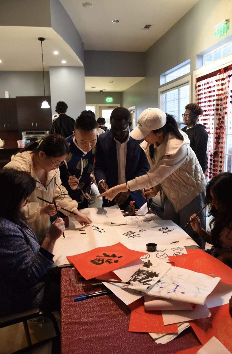 Students learning Chinese Calligraphy. PN/ David Beltran